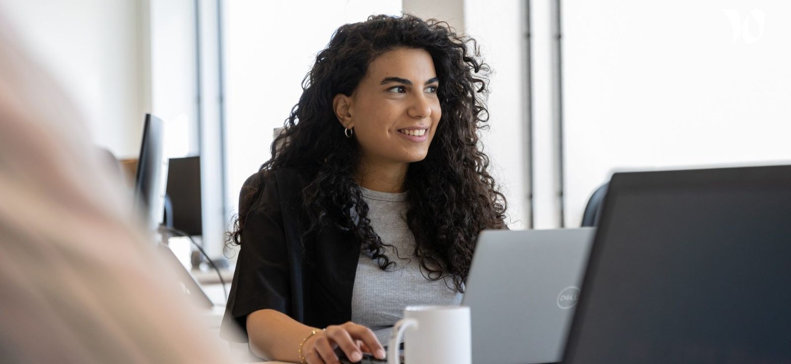 A Novelis employee at her desk
